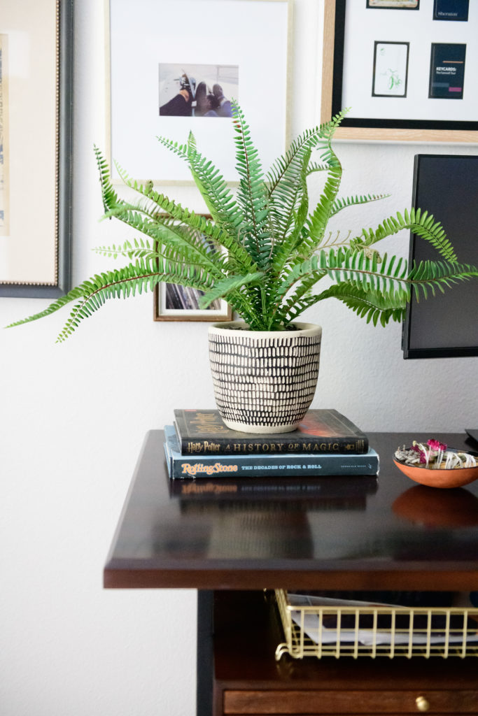 Adding texture and warmth to your study room #interiordesign #greenery #gallerywall #coffeetablebooks #officedesign 